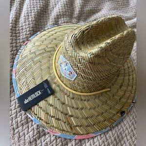 Straw beach hat, with chin strap to keep secure